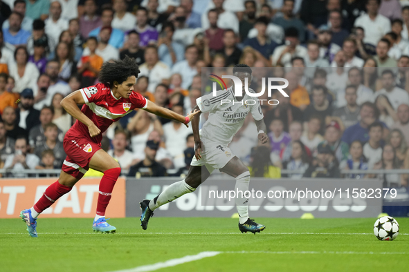 Vinicius Junior left winger of Real Madrid and Brazil and Anrie Chase centre-back of Stuttgart and Japan compete for the ball during the UEF...