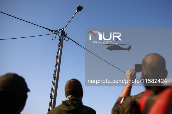 The Sikorsky UH-60 Black Hawk military helicopter is seen after Nysa Klodzka river flooded town of Lewin Brzeski in southwestern Poland, on...