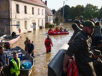 Residents are being evacuated by emergency workers after Nysa Klodzka river flooded town of Lewin Brzeski in southwestern Poland, on Septemb...