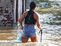 A resident is seen walking in a water after Nysa Klodzka river flooded town of Lewin Brzeski in southwestern Poland, on September 17th, 2024...