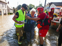 Residents are being evacuated by emergency workers after Nysa Klodzka river flooded town of Lewin Brzeski in southwestern Poland, on Septemb...