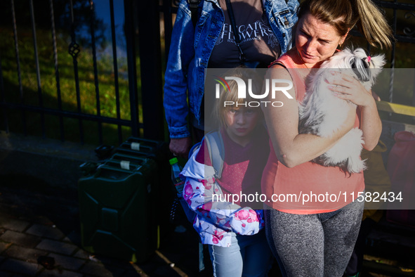 Residents which were evacuated by emergency workers after Nysa Klodzka river flooded town of Lewin Brzeski in southwestern Poland, on Septem...