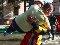 Residents are being evacuated by emergency workers after Nysa Klodzka river flooded town of Lewin Brzeski in southwestern Poland, on Septemb...