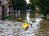 A resident swims in a canoe after Nysa Klodzka river flooded town of Lewin Brzeski in southwestern Poland, on September 17th, 2024. Storm Bo...