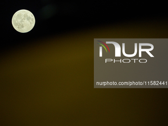 The Harvest Moon full moon is seen in the night sky over Frankfurt an der Oder, Germany on 17 September, 2024. (