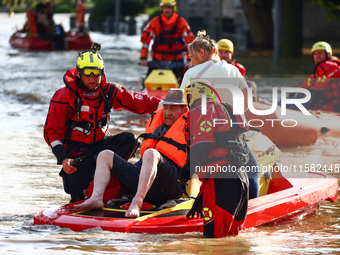 Residents are being evacuated by emergency workers after Nysa Klodzka river flooded town of Lewin Brzeski in southwestern Poland, on Septemb...