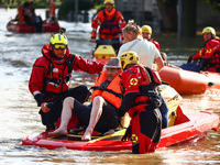 Residents are being evacuated by emergency workers after Nysa Klodzka river flooded town of Lewin Brzeski in southwestern Poland, on Septemb...