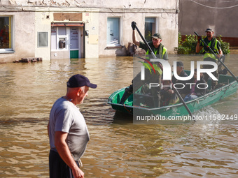 Residents are being evacuated by emergency workers after Nysa Klodzka river flooded town of Lewin Brzeski in southwestern Poland, on Septemb...