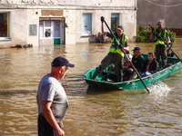 Residents are being evacuated by emergency workers after Nysa Klodzka river flooded town of Lewin Brzeski in southwestern Poland, on Septemb...