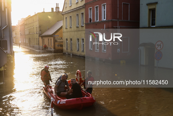 Residents are being evacuated by emergency workers after Nysa Klodzka river flooded town of Lewin Brzeski in southwestern Poland, on Septemb...