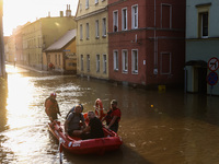 Residents are being evacuated by emergency workers after Nysa Klodzka river flooded town of Lewin Brzeski in southwestern Poland, on Septemb...