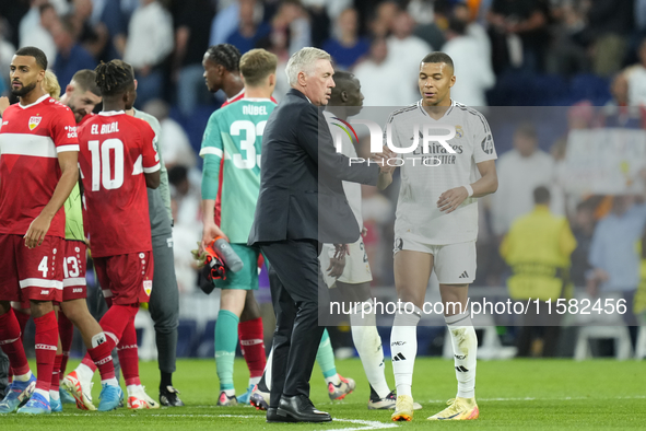 Carlo Ancelotti head coach of Real Madrid and Kylian Mbappe centre-forward of Real Madrid and France celebrate victory after the UEFA Champi...