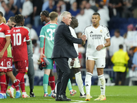 Carlo Ancelotti head coach of Real Madrid and Kylian Mbappe centre-forward of Real Madrid and France celebrate victory after the UEFA Champi...