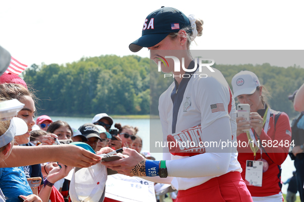 GAINESVILLE, VIRGINIA - SEPTEMBER 15: Nelly Korda of the United States signs autographs after a Team USA win at the conclusion of the Solhei...