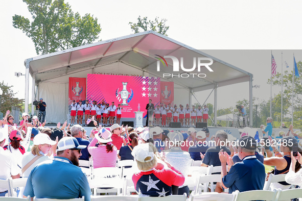 GAINESVILLE, VIRGINIA - SEPTEMBER 15: Sports commentator Grant Boone speaks as members of Team USA  and their caddies, including Sarah Schme...