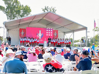 GAINESVILLE, VIRGINIA - SEPTEMBER 15: Sports commentator Grant Boone speaks as members of Team USA  and their caddies, including Sarah Schme...