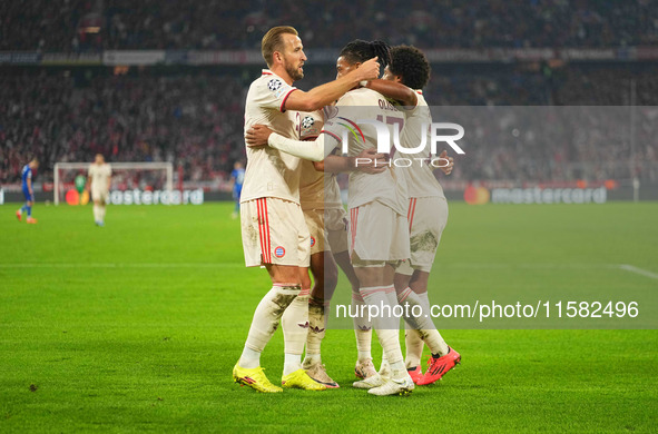 Michael Olise of Bayern Munich    celebrates  the teams sixth goal  during the Champions League Round 1 match between Bayern Munich v Dinamo...