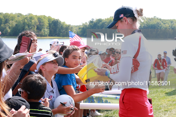 GAINESVILLE, VIRGINIA - SEPTEMBER 15: Nelly Korda of the United States signs autographs after a Team USA win at the conclusion of the Solhei...