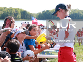 GAINESVILLE, VIRGINIA - SEPTEMBER 15: Nelly Korda of the United States signs autographs after a Team USA win at the conclusion of the Solhei...