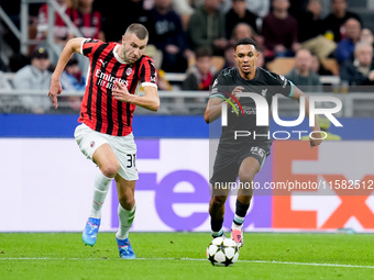 Strahinja Pavlovic of AC Milan and Trent Alexander-Arnold of Liverpool FC compete for the ball during the UEFA Champions League 2024/25 Leag...