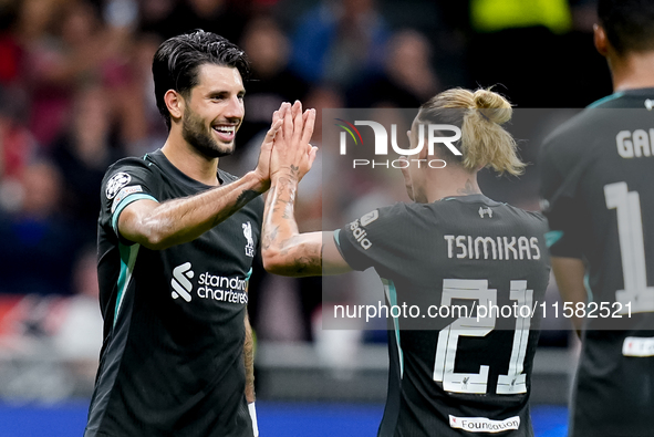 Dominik Szoboszlai of Liverpool FC celebrates with Kostas Tsimikas after scoring third goal during the UEFA Champions League 2024/25 League...