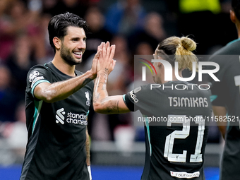 Dominik Szoboszlai of Liverpool FC celebrates with Kostas Tsimikas after scoring third goal during the UEFA Champions League 2024/25 League...