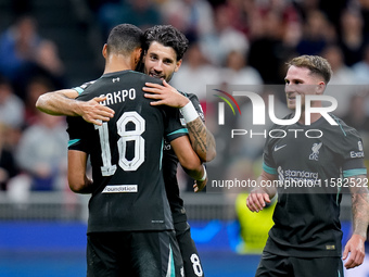 Dominik Szoboszlai of Liverpool FC celebrates with Cody Gakpo after scoring third goal during the UEFA Champions League 2024/25 League Phase...