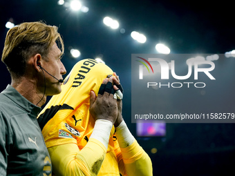 Mike Maignan of AC Milan leaves the pitch injured during the UEFA Champions League 2024/25 League Phase MD1 match between AC Milan and Liver...