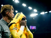 Mike Maignan of AC Milan leaves the pitch injured during the UEFA Champions League 2024/25 League Phase MD1 match between AC Milan and Liver...