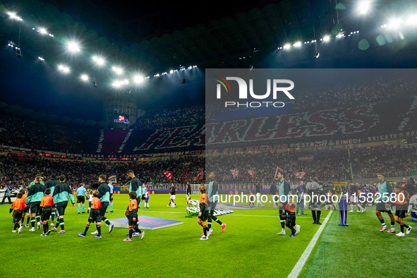 Supporters of AC Milan during the UEFA Champions League 2024/25 League Phase MD1 match between AC Milan and Liverpool FC at Stadio San Siro...