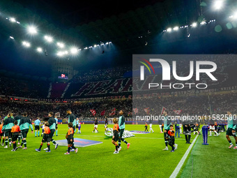 Supporters of AC Milan during the UEFA Champions League 2024/25 League Phase MD1 match between AC Milan and Liverpool FC at Stadio San Siro...