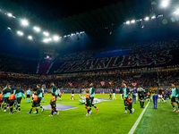 Supporters of AC Milan during the UEFA Champions League 2024/25 League Phase MD1 match between AC Milan and Liverpool FC at Stadio San Siro...