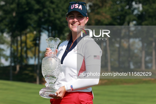 GAINESVILLE, VIRGINIA - SEPTEMBER 15: Lauren Coughlin of the United States holds the winning trophy on the 18th green at the conclusion of t...