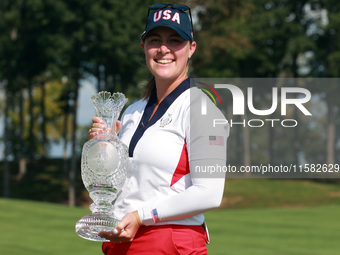 GAINESVILLE, VIRGINIA - SEPTEMBER 15: Lauren Coughlin of the United States holds the winning trophy on the 18th green at the conclusion of t...