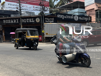 A man carries a large pipe on his scooter in Thiruvananthapuram (Trivandrum), Kerala, India, on April 2, 2024. (