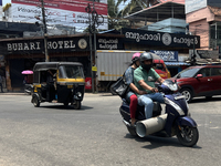 A man carries a large pipe on his scooter in Thiruvananthapuram (Trivandrum), Kerala, India, on April 2, 2024. (