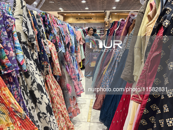 Women shop for designer churidars at a textile shop in Thiruvananthapuram, Kerala, India, on April 10, 2024. 