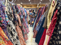 Women shop for designer churidars at a textile shop in Thiruvananthapuram, Kerala, India, on April 10, 2024. (