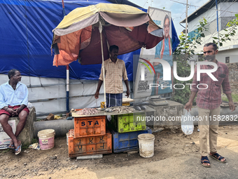 A man sells fish along the roadside in Ambalathara, Thiruvananthapuram (Trivandrum), Kerala, India, on April 14, 2024. (