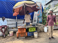 A man sells fish along the roadside in Ambalathara, Thiruvananthapuram (Trivandrum), Kerala, India, on April 14, 2024. (