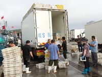 Citizens buy various kinds of seafood unloaded at Jimiya fishing Port in the West Coast New Area in Qingdao, China, on September 18, 2024. (