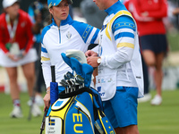 GAINESVILLE, VIRGINIA - SEPTEMBER 13: Linn Grant of Team Europe interacts with her caddy on the third green during Foursome Matches on Day O...