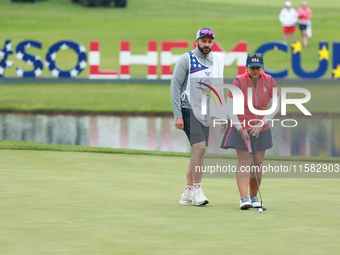 GAINESVILLE, VIRGINIA - SEPTEMBER 13: Lilia Vu of Team USA lines up her putt on the 4th green during Foursome Matches on Day One of the Solh...