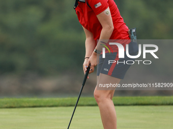 GAINESVILLE, VIRGINIA - SEPTEMBER 13: Lauren Coughlin of the United States plays her putt on the 11th green during Foursome Matches on Day O...