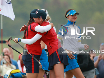 GAINESVILLE, VIRGINIA - SEPTEMBER 13: Allisen Corpuz of the United States is congratulated by teammate Nelly Korda after making the winning...