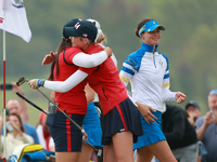 GAINESVILLE, VIRGINIA - SEPTEMBER 13: Allisen Corpuz of the United States is congratulated by teammate Nelly Korda after making the winning...