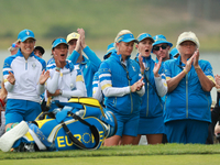 GAINESVILLE, VIRGINIA - SEPTEMBER 13: Some members of Team Europe cheer at the 16th green after Emily Kristine Pedersen’s putt during Fourso...