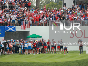 GAINESVILLE, VIRGINIA - SEPTEMBER 13: Megan Khang of the United States plays her tee shot on the first hole as former president Barack Obama...