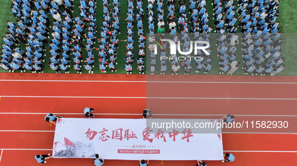 Prosecutors organize a ''9.18'' patriotic education activity on the campus of No. 1 Middle School in Lianyungang, China, on September 18, 20...