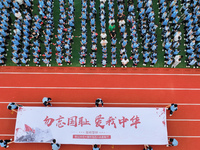 Prosecutors organize a ''9.18'' patriotic education activity on the campus of No. 1 Middle School in Lianyungang, China, on September 18, 20...